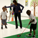 Image for article titled Michelle Obama and Amy Poehler Played Mini-Golf With Kids Together